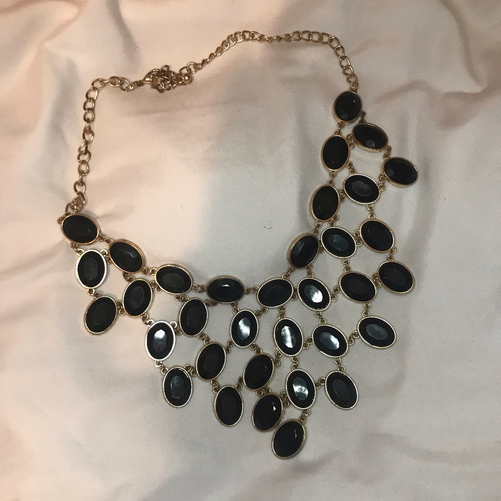 gold and black necklace